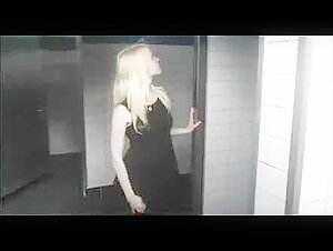 She caresses herself in the public toilet in front of voyeurs